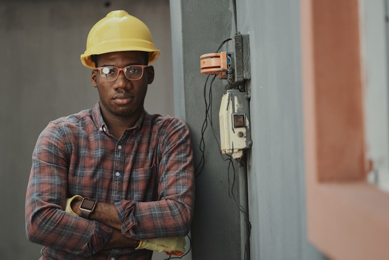 Electrician working on commercial electrical panel